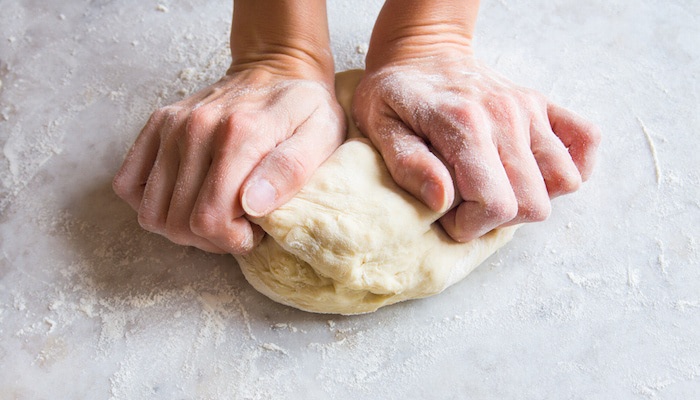 Hands Kneading Pizza Dough.jpg